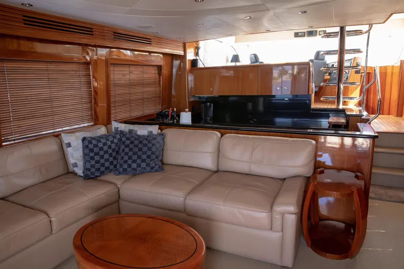 Slide: The Image of Luxurious interior of 2002 Hatteras 63 Raised Pilothouse Motor Yacht with leather seating and wood finishes. - 30