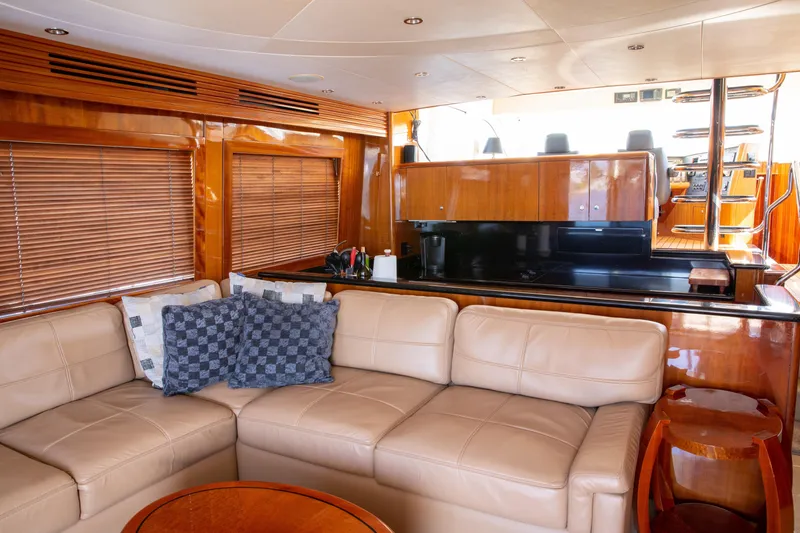 Slide: The Image of Luxurious interior of 2002 Hatteras 63 Raised Pilothouse Motor Yacht with leather seating and wood finishes. - 33