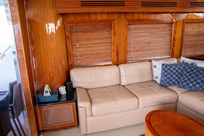 Slide: The Image of Luxurious interior of 2002 Hatteras 63 Raised Pilothouse Motor Yacht with leather seating and wooden accents. - 34