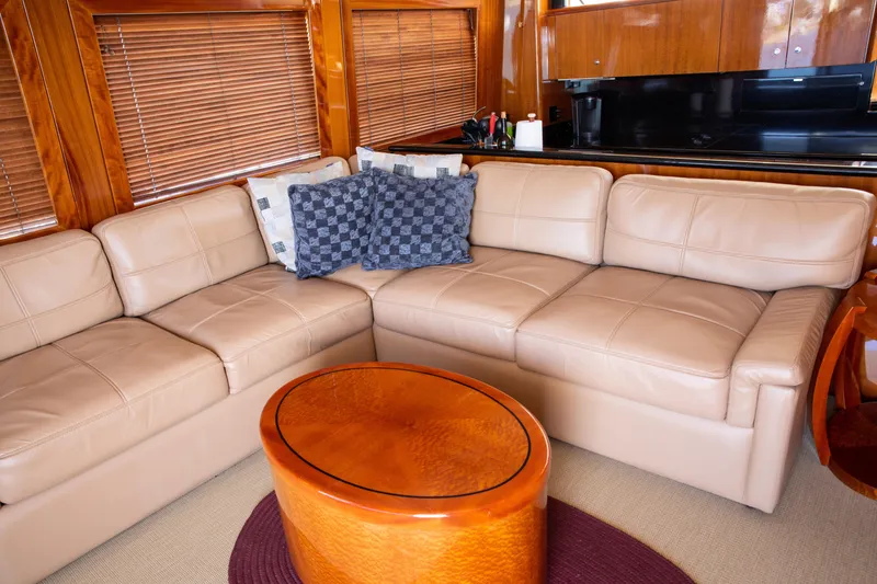 Slide: The Image of Luxurious interior of 2002 Hatteras 63 Raised Pilothouse Motor Yacht with leather seating and wooden accents. - 35