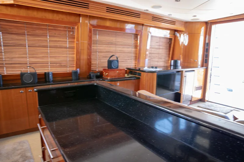 Slide: The Image of Luxurious interior of 2002 Hatteras 63 Raised Pilothouse Motor Yacht with sleek wood finishes. - 40