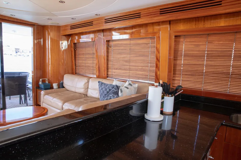 Slide: The Image of Luxurious interior of 2002 Hatteras 63 Raised Pilothouse Motor Yacht with leather seating and wooden blinds. - 41