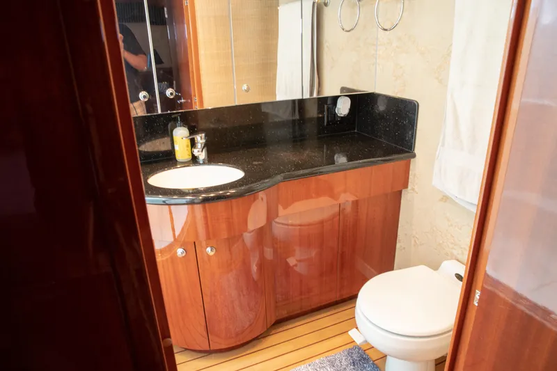 Slide: The Image of Luxurious bathroom in 2002 Hatteras 63 Raised Pilothouse Motor Yacht with wood cabinetry. - 52