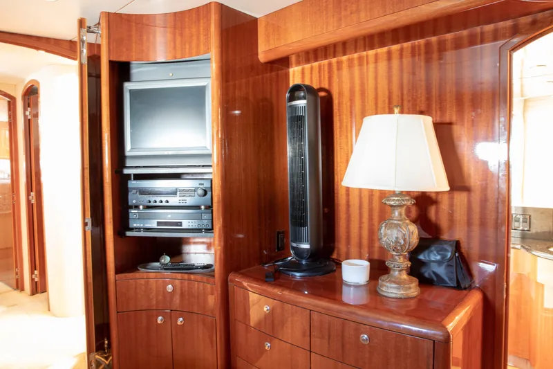 Slide: The Image of Luxurious interior of 2002 Hatteras 63 Yacht with TV, fan, and lamp. - 53