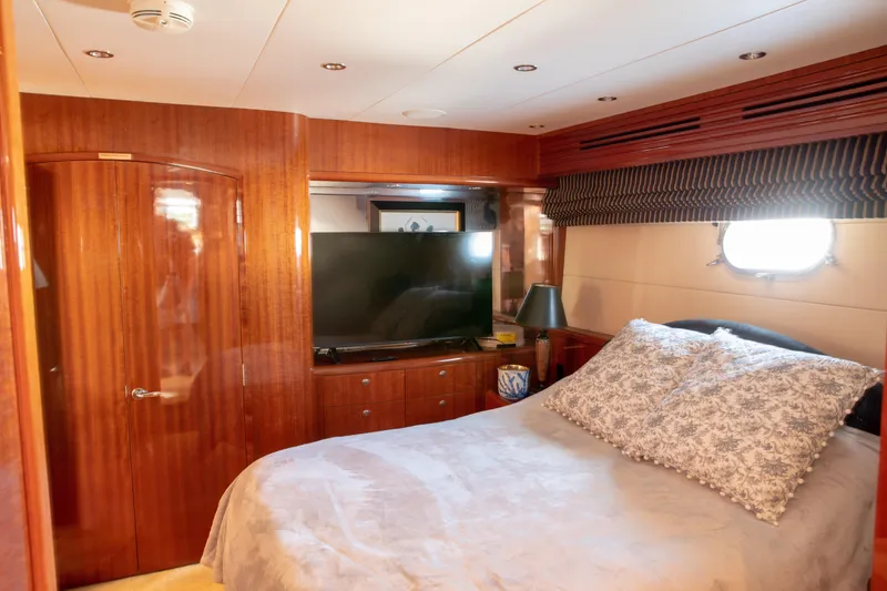 Slide: The Image of Luxurious bedroom interior of 2002 Hatteras 63 Raised Pilothouse Motor Yacht. - 54