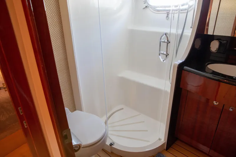 Slide: The Image of Bathroom interior of 2002 Hatteras 63 Raised Pilothouse Motor Yacht with shower and vanity. - 56