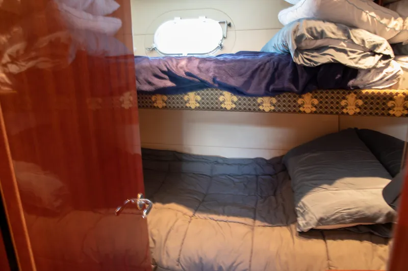 Slide: The Image of Cozy bunk beds in 2002 Hatteras 63 Raised Pilothouse Motor Yacht cabin. - 60