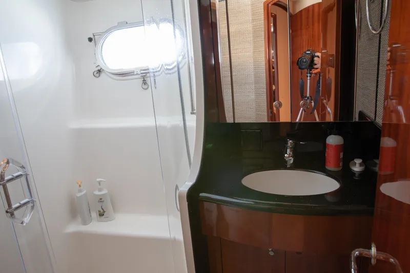 Slide: The Image of Luxurious bathroom in 2002 Hatteras 63 Raised Pilothouse Motor Yacht with modern fixtures. - 64