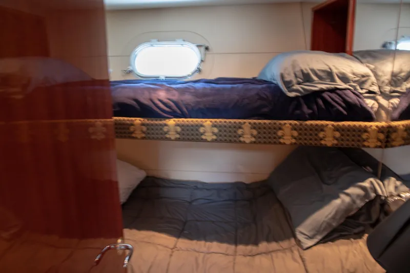 Slide: The Image of Cozy bunk beds in 2002 Hatteras 63 Raised Pilothouse Motor Yacht cabin. - 65