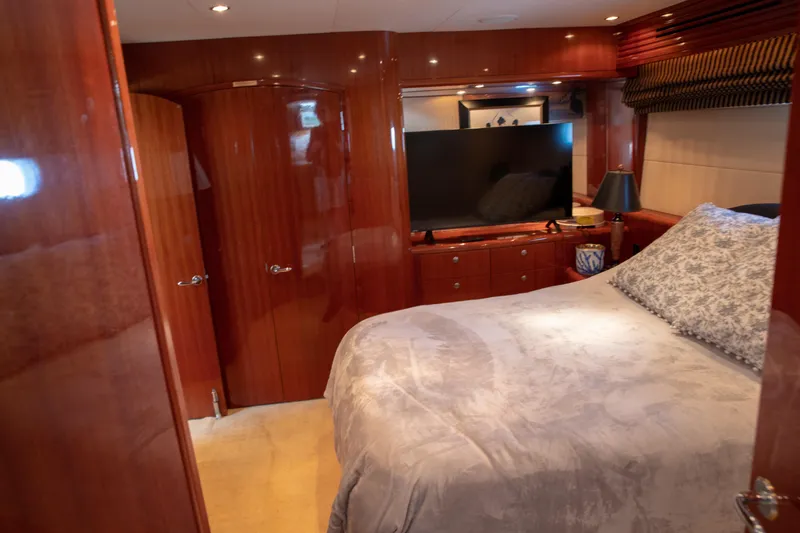 Slide: The Image of Luxurious bedroom interior of a 2002 Hatteras 63 Raised Pilothouse Motor Yacht. - 67