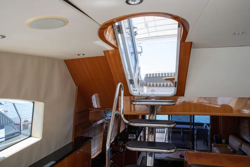 Slide: The Image of Interior view of 2002 Hatteras 63 Raised Pilothouse Motor Yacht with modern staircase. - 85