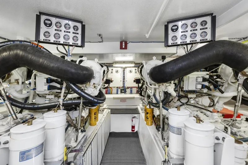 Slide: The Image of Engine room of 2002 Hatteras 63 Raised Pilothouse Motor Yacht with gauges and machinery. - 89