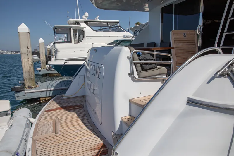 Slide: The Image of 2002 Hatteras 63 Raised Pilothouse Motor Yacht docked at marina. - 9