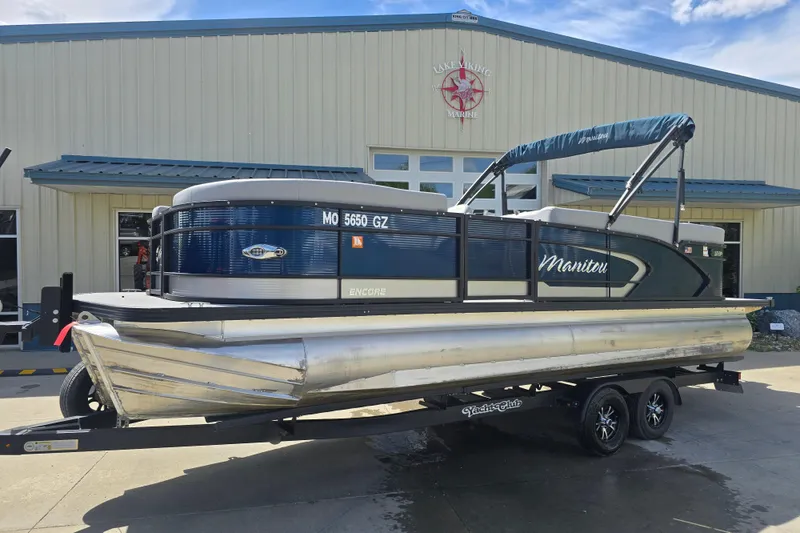 The Image of 2022 Manitou 23 Encore RF pontoon boat on trailer at Lake Viking Marine. - 0