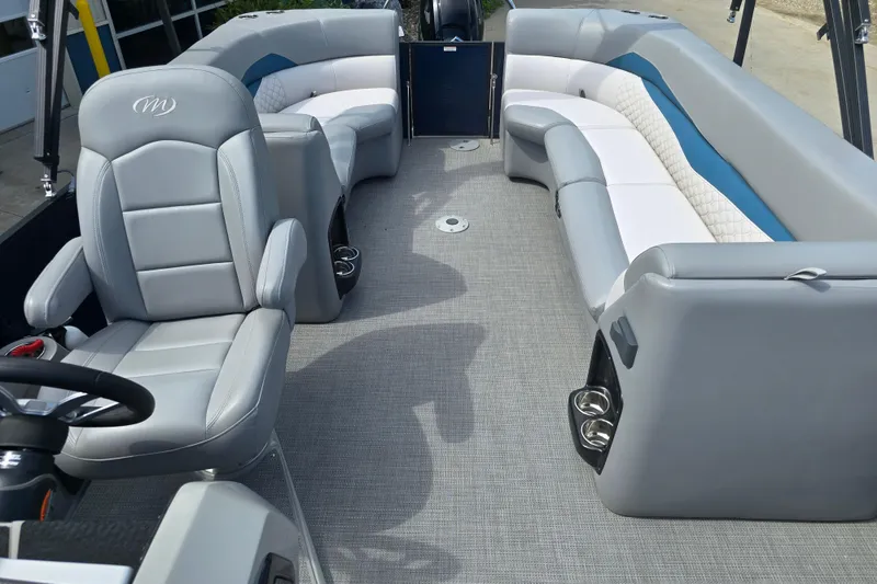 Slide: The Image of 2022 Manitou 23 Encore RF pontoon boat interior with gray seating and modern design. - 14