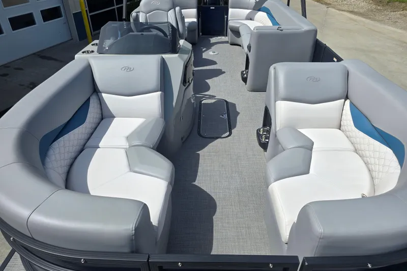 Slide: The Image of 2022 Manitou 23 Encore RF pontoon boat interior with luxurious seating and modern design. - 7