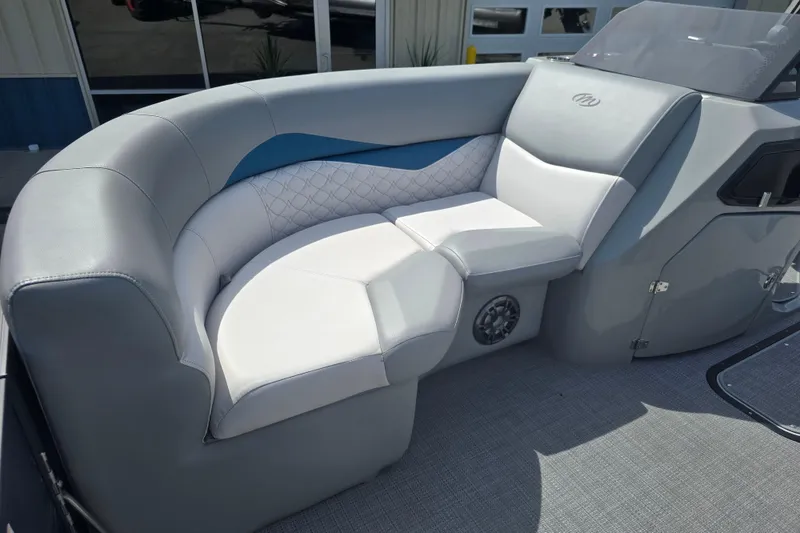 Slide: The Image of Luxurious seating on 2022 Manitou 23 Encore RF pontoon boat, featuring elegant upholstery and modern design. - 8