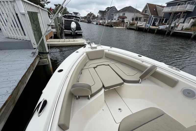 Slide: The Image of 2022 Key West 239 FS boat docked in a residential canal setting. - 14