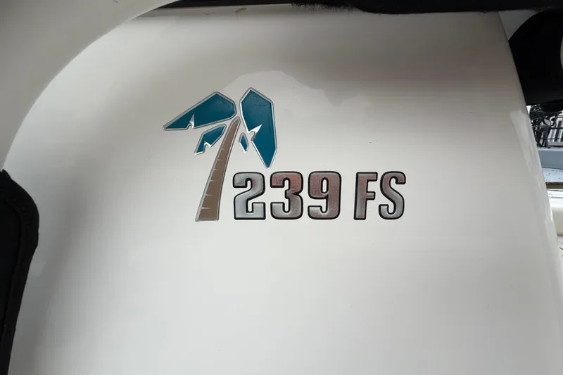 Slide: The Image of Key West 239 FS 2022 boat logo on white surface. - 17