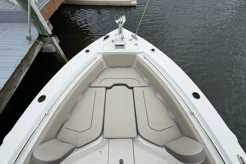 Slide: The Image of Bow seating area of 2022 Key West 239 FS boat docked by water. - 18