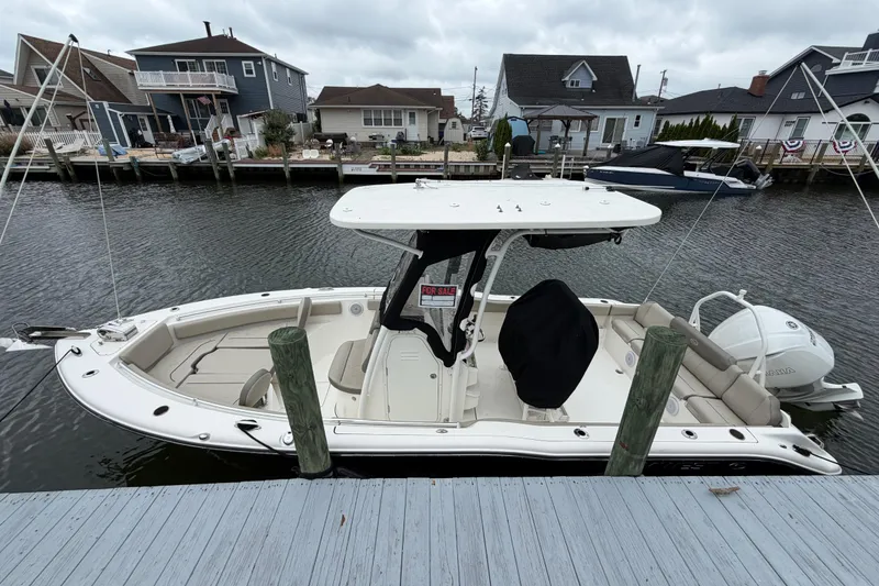 The Image of 2022 Key West 239 FS boat docked by waterfront homes. - 5