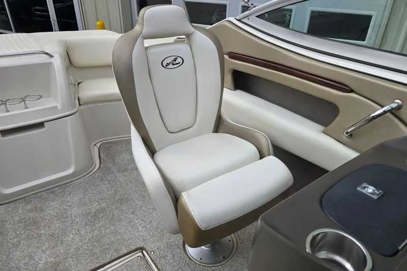 Slide: The Image of Interior of a 2007 Sea Ray 210 Select boat featuring a comfortable captain's chair. - 17