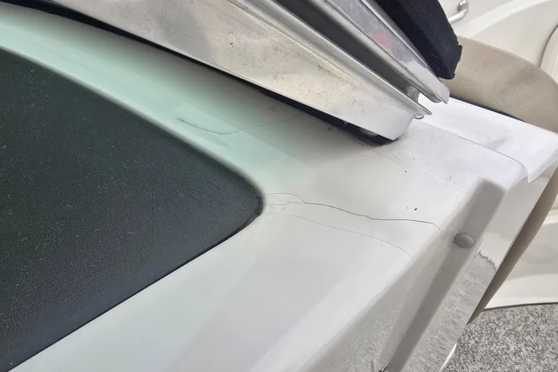 Slide: The Image of Close-up of 2007 Sea Ray 210 Select boat showing surface cracks. - 27
