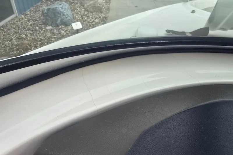 Slide: The Image of Close-up of 2007 Sea Ray 210 Select boat dashboard with visible wear. - 28
