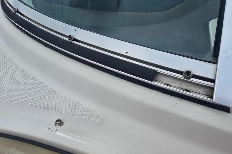 Slide: The Image of Close-up of 2007 Sea Ray 210 Select boat windshield and deck details. - 29