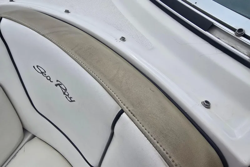 Slide: The Image of 2007 Sea Ray 210 Select boat interior with logo and upholstery detail. - 32