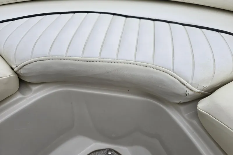 Slide: The Image of White leather seating on a 2007 Sea Ray 210 Select boat, showing slight wear. - 34