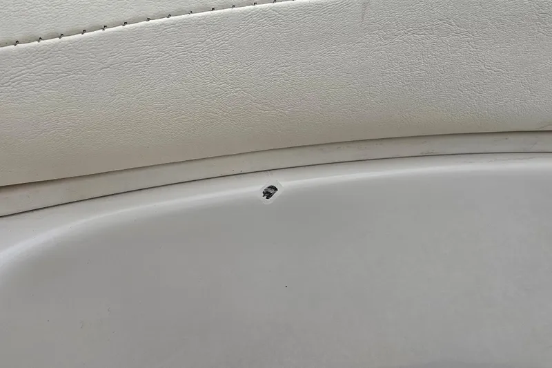 Slide: The Image of Small hole in the interior of a 2007 Sea Ray 210 Select boat. - 35
