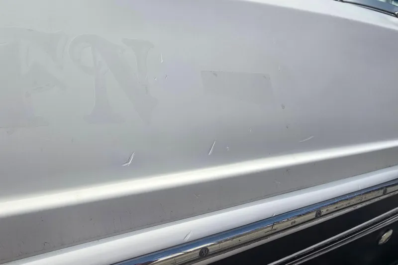 Slide: The Image of Close-up of 2007 Sea Ray 210 Select boat hull with minor scratches. - 37
