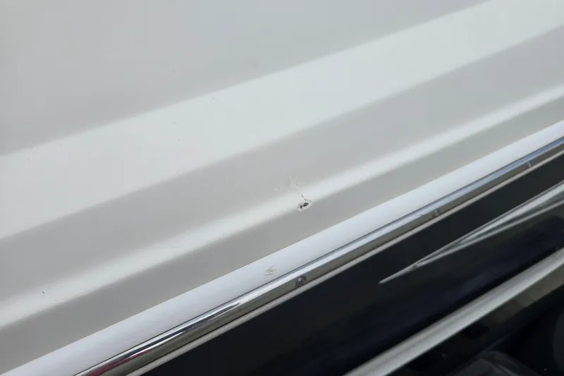 Slide: The Image of Close-up of 2007 Sea Ray 210 Select boat hull with minor surface damage. - 39