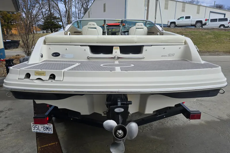 Slide: The Image of 2007 Sea Ray 210 Select boat on trailer, rear view showing swim platform and propeller. - 4