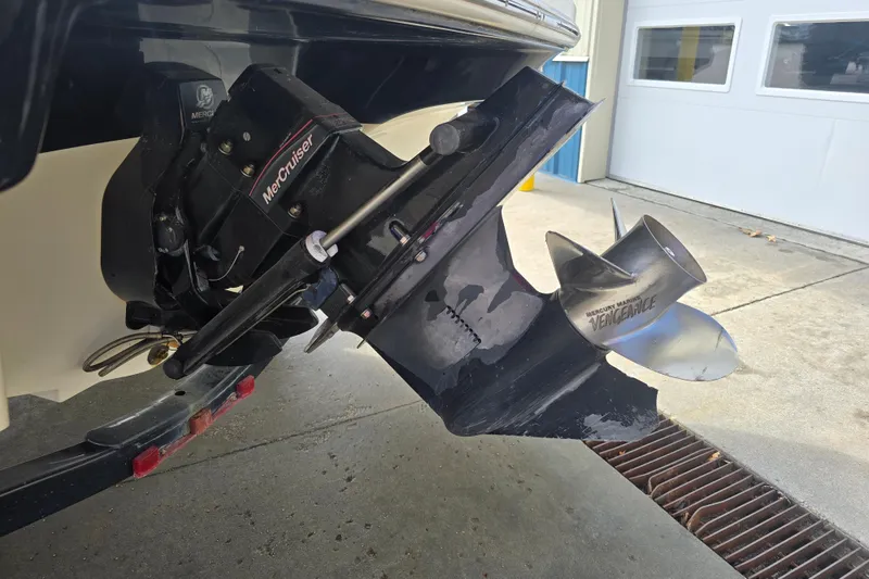 Slide: The Image of MerCruiser outdrive on 2007 Sea Ray 210 Select with Vengeance propeller. - 5