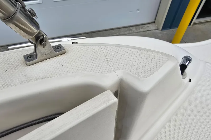 Slide: The Image of Close-up of 2003 Sea Ray 220 Sundeck boat deck with stainless steel fittings. - 22