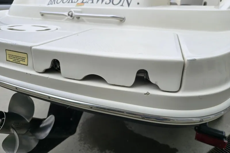 Slide: The Image of Rear view of 2003 Sea Ray 220 Sundeck boat with visible propeller. - 26