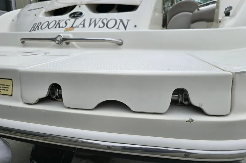 Slide: The Image of 2003 Sea Ray 220 Sundeck boat stern with swim platform and ladder. - 28