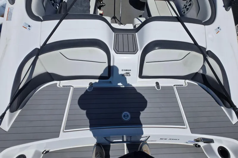 Slide: The Image of 2018 Yamaha AR210 boat deck with seating and shadow, New Jersey registration. - 10