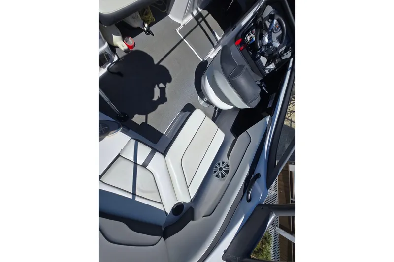 Slide: The Image of 2018 Yamaha AR210 boat interior with seating and steering wheel. - 18