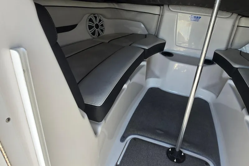 Slide: The Image of 2018 Yamaha Boats AR210 interior with seating and speaker system. - 21