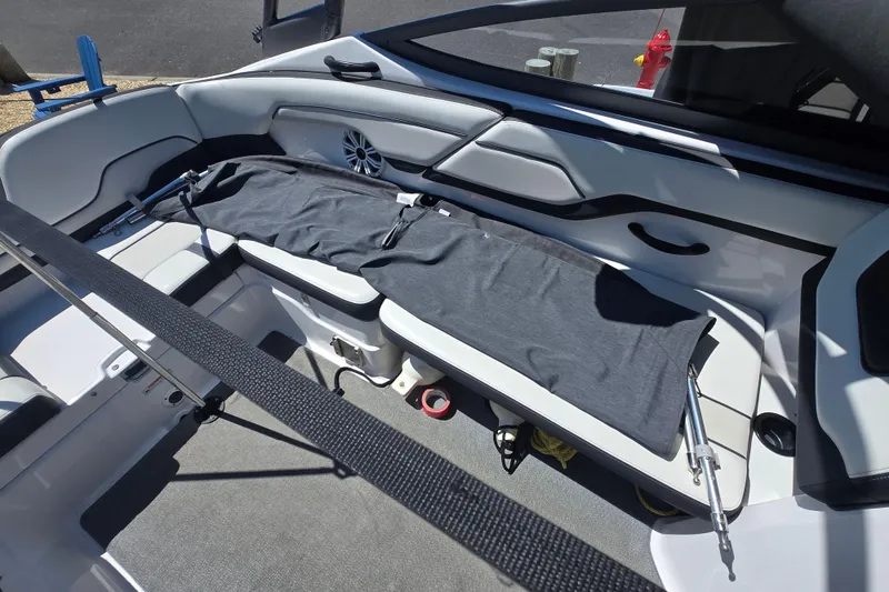 Slide: The Image of 2018 Yamaha AR210 boat interior with seating and storage compartments. - 24