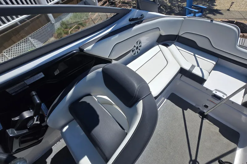 Slide: The Image of Interior view of 2018 Yamaha AR210 boat, featuring sleek seating and modern design. - 25