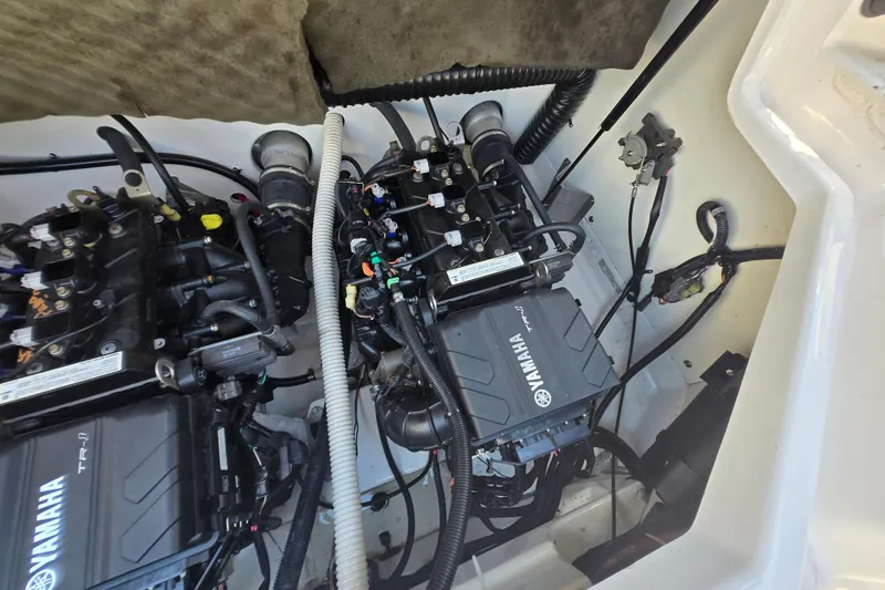 Slide: The Image of Engine compartment of a 2018 Yamaha Boats AR210, showcasing dual Yamaha TR-1 engines. - 29