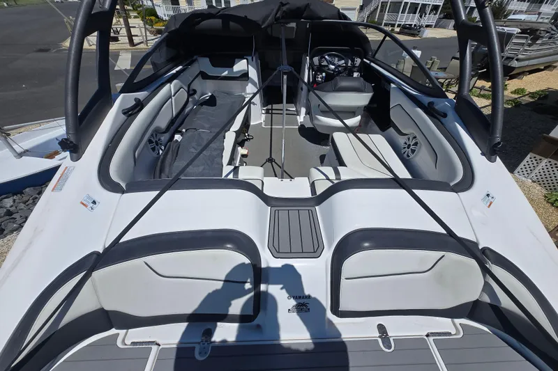 Slide: The Image of 2018 Yamaha Boats AR210 interior with seating and steering wheel. - 3