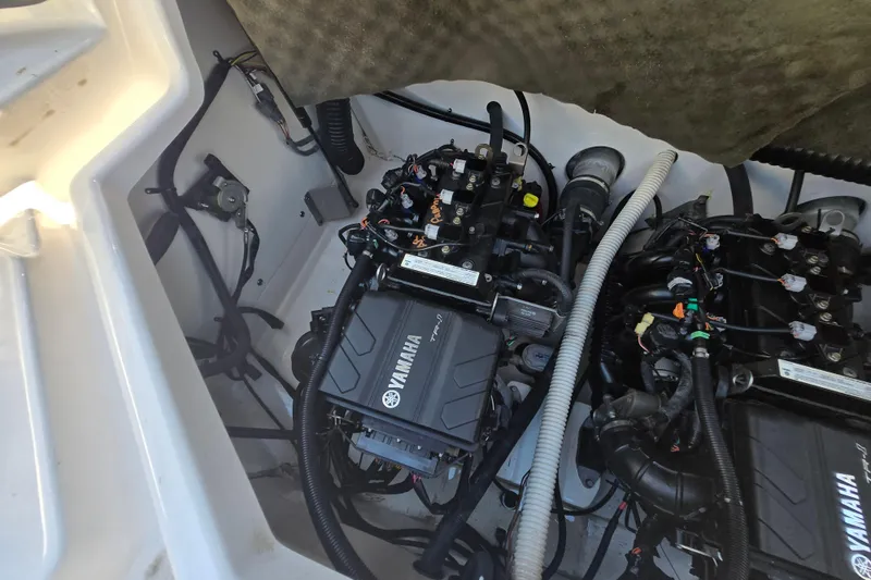 Slide: The Image of Engine compartment of a 2018 Yamaha Boats AR210, showcasing dual Yamaha engines. - 30
