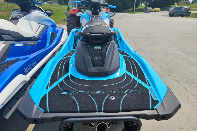 Slide: The Image of 2022 Yamaha WaveRunner GP1800R HO in vibrant blue, parked outdoors. - 2