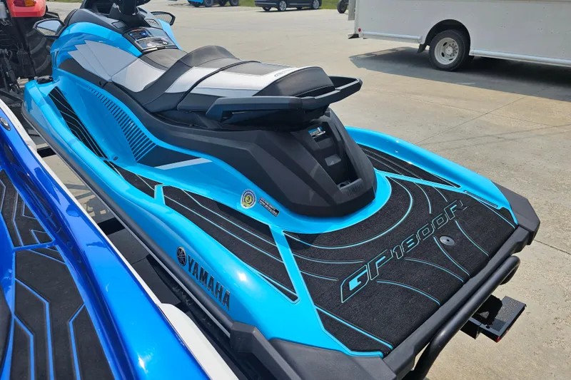 Slide: The Image of 2022 Yamaha WaveRunner GP1800R HO in vibrant blue, parked outdoors. - 3