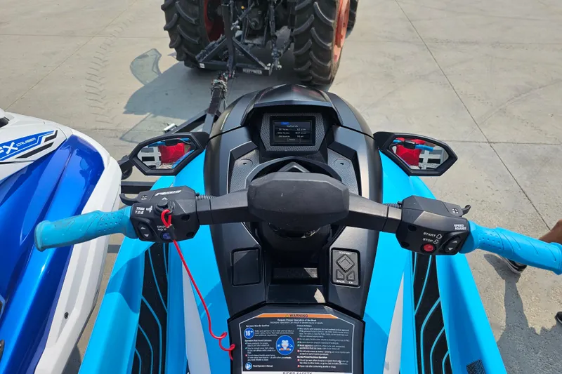 Slide: The Image of 2022 Yamaha WaveRunner GP1800R HO dashboard with blue handlebars and control panel. - 5